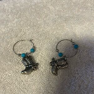 Hoop silver earrings with a silver cowboy boot in a blue pearl